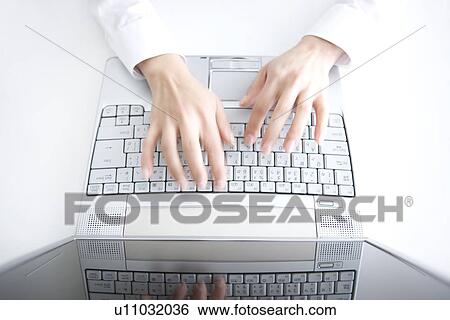 Stock Photograph - Person typing on laptop. Fotosearch