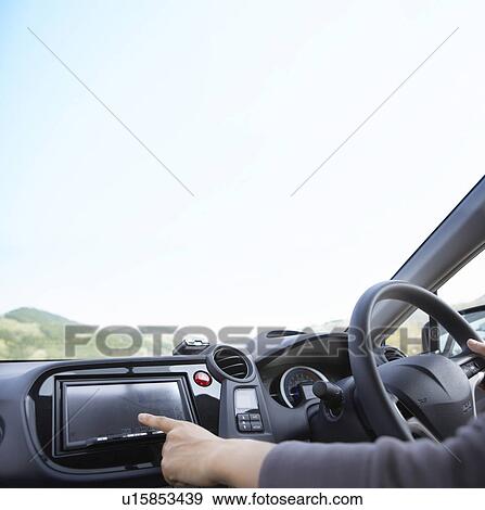 Person using GPS in a car View Large Photo Image Stock Photo - Person using GPS in a car. Fotosearch