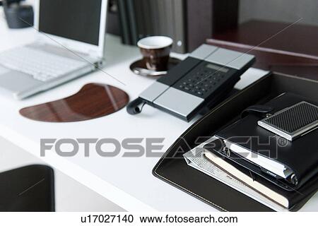 Stock Image - Personal organizer on office desk. Fotosearch