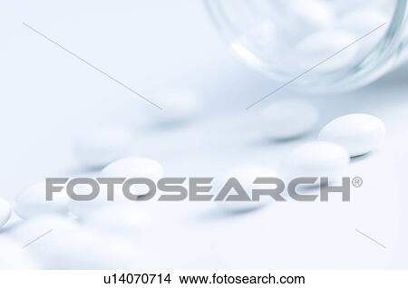 Pills spilling out of a jar View Large Photo Image Picture - Pills spilling out of a jar. Fotosearch