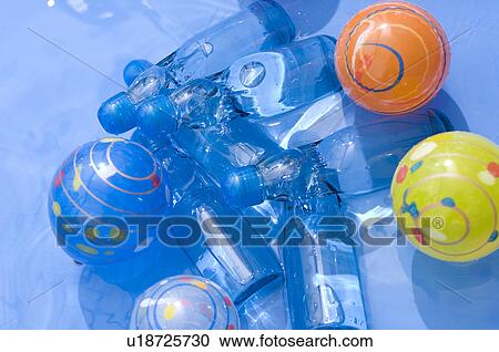 Plastic bottles, balloons and balls floating in a paddling pool View Large Photo Image Stock Image - Plastic bottles, balloons and balls floating in a paddling pool. Fotosearch