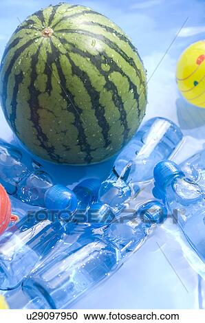 Plastic bottles, balls and balloons and a watermelon floating in a paddling pool View Large Photo Image Stock Image - Plastic bottles, balls and balloons and a watermelon floating in a paddling pool. Fotosearch