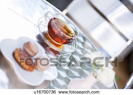 Stock Photograph - Plate of cookies and a cup of tea. Fotosearch