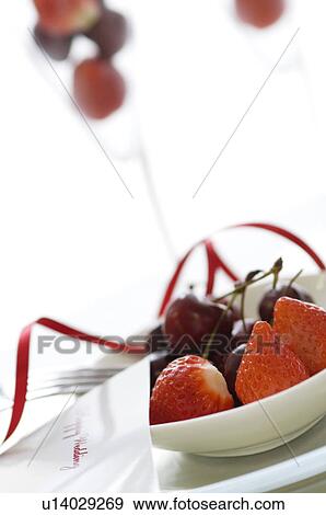 Stock Photo - Plate of fruit and a wedding card. Fotosearch