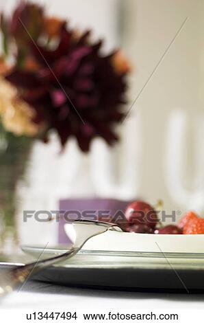 Plate of fruit and vase of flowers View Large Photo Image Picture - Plate of fruit and vase of flowers. Fotosearch