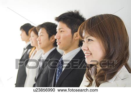 Stock Image - Portrait of businessmen and businesswomen. Fotosearch