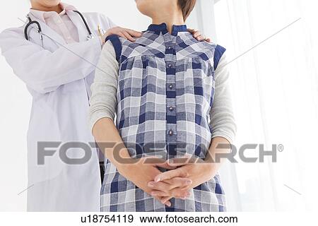 Pregnant woman having check up with gynecologist View Large Photo Image Stock Photo - Pregnant woman having check up with gynecologist. Fotosearch