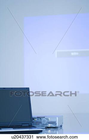 Stock Image - Projector and laptop. Fotosearch