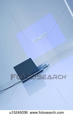 Stock Photograph - Projector and laptop. Fotosearch