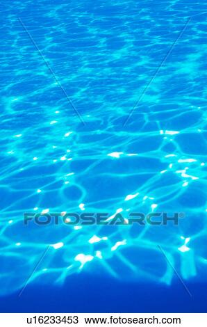 Stock Image - Rippled water surface. Fotosearch