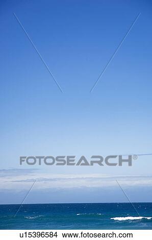 Picture - Sea under blue sky. Fotosearch