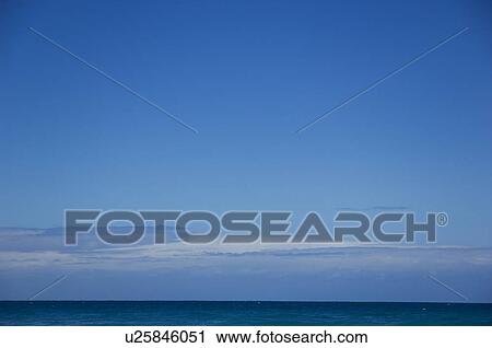 Stock Image - Sea under blue sky. Fotosearch