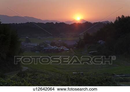 Setting sun in the countryside View Large Photo Image Picture - Setting sun in the countryside. Fotosearch
