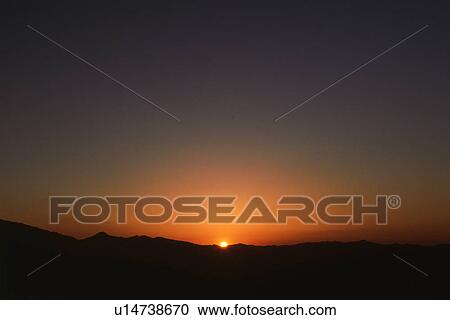 Stock Image - Setting sun. Fotosearch