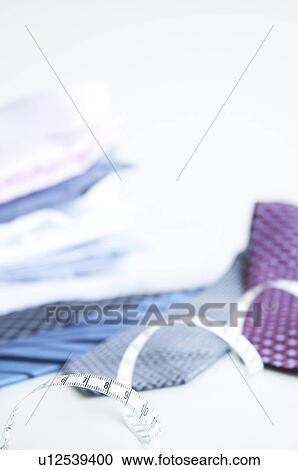 Shirts and ties and a measuring tape View Large Photo Image Stock Image - Shirts and ties and a measuring tape. Fotosearch