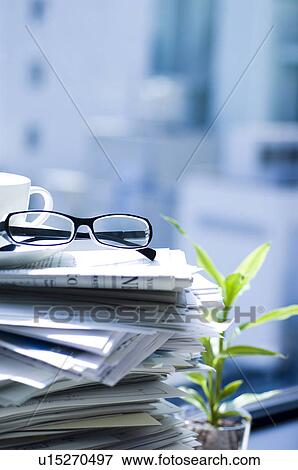Stock Photo - Spectacles on a stack of documents. Fotosearch
