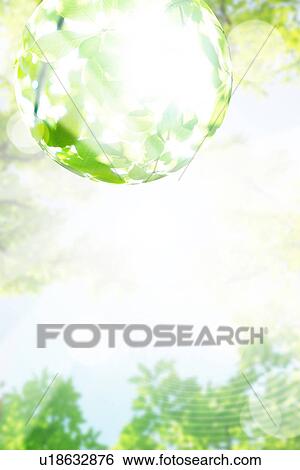 Stock Photograph - Sphere reflecting green leaves. Fotosearch