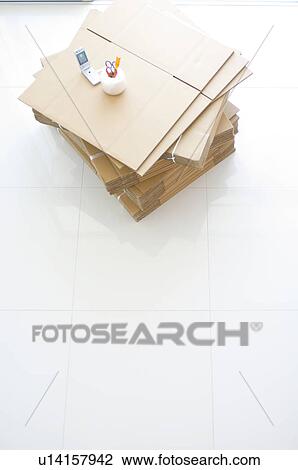 Stock Image - Stack of cardboard boxes and packaging items. Fotosearch