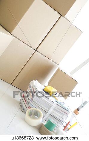 Stock Photo - Stack of cardboard boxes and packaging items. Fotosearch