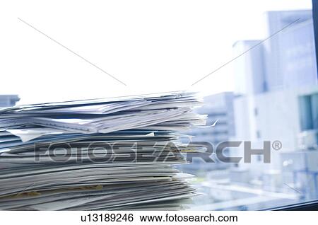 Stock Photograph - Stack of documents in an office. Fotosearch
