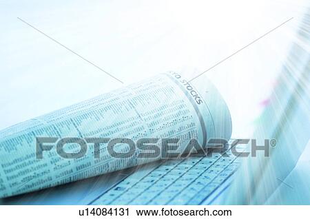 Stock Image - Stock market figures and a laptop. Fotosearch