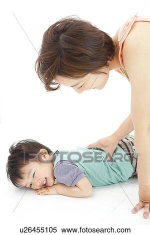 Studio portrait of young mother playing with her preschool age son View Large Photo Image Stock Photography - Studio portrait of young mother playing with her preschool age son. Fotosearch