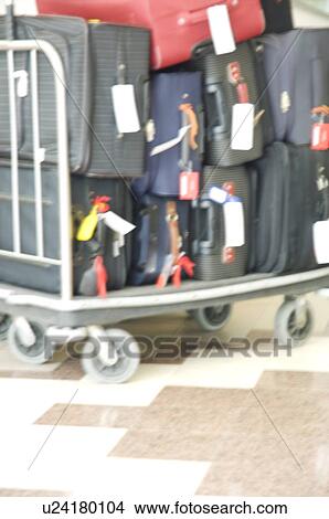 Picture - Suitcases on a luggage cart. Fotosearch