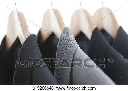 Suits on a clothes rack View Large Photo Image Stock Photograph - Suits on a clothes rack. Fotosearch