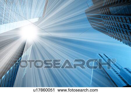 Stock Image - Sun shining on skyscrapers. Fotosearch