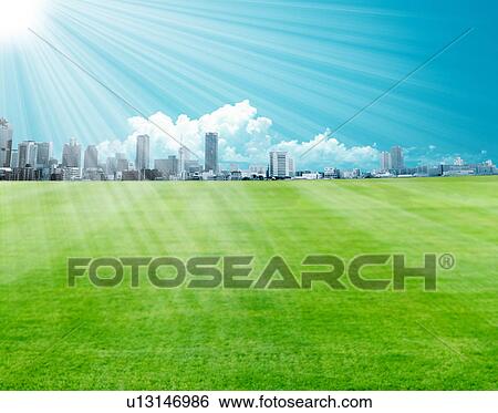 Stock Photograph - Sunbeams shining on cityscape. Fotosearch