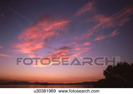 Sunset over a lake View Large Photo Image Stock Photo - Sunset over a lake. Fotosearch