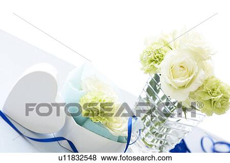 Table setting with flowers and blue ribbon View Large Photo Image Stock Photo - Table setting with flowers and blue ribbon. Fotosearch