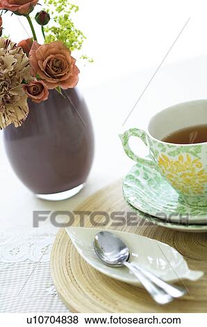 Stock Photo - Tea cup on table setting. Fotosearch