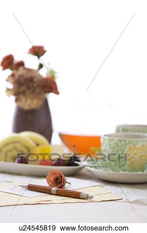 Tea cup on table setting View Large Photo Image Stock Photo - Tea cup on table setting. Fotosearch