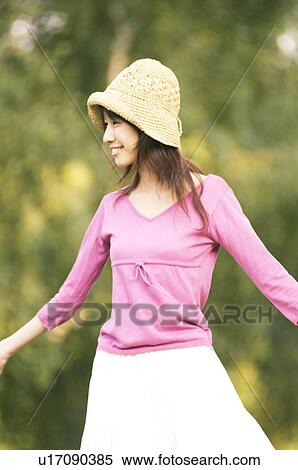 The woman wearing a hat of a smile View Large Photo Image Stock Photography - The woman wearing a hat of a smile. Fotosearch