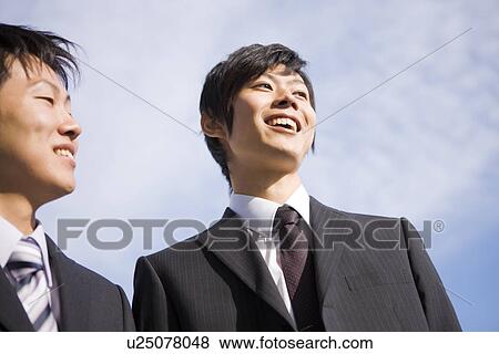 Two businessmen smiling View Large Photo Image Stock Photo - Two businessmen smiling. Fotosearch