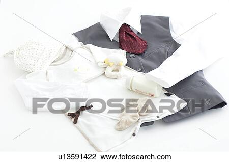 Stock Image - Uniform and baby clothes. Fotosearch