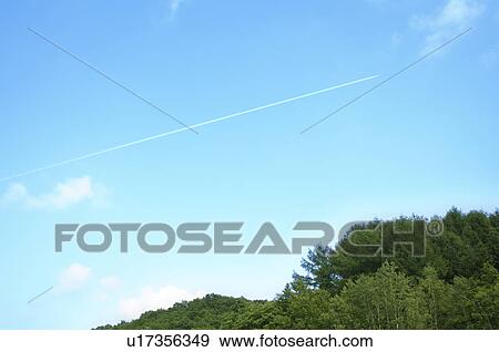Stock Photo - Vapor trail in a clear blue sky. Fotosearch
