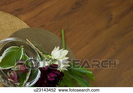 Stock Image - Vase of Hosta and Dahlia. Fotosearch