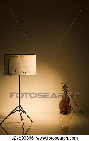 Stock Photograph - Violin and sheet music on a stand. Fotosearch