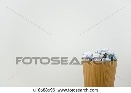 Wastepaper bin with crumpled paper View Large Photo Image Stock Photograph - Wastepaper bin with crumpled paper. Fotosearch