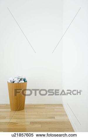 Stock Photography - Wastepaper bin with crumpled paper. Fotosearch