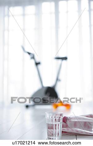Water bottle and an exercise bike View Large Photo Image Picture - Water bottle and an exercise bike. Fotosearch