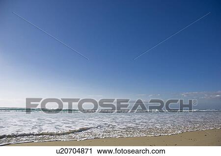 Waves lapping on beach View Large Photo Image Stock Image - Waves lapping on beach. Fotosearch