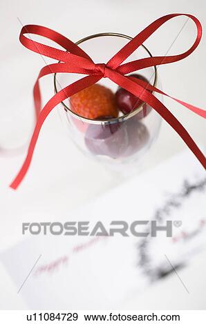 Stock Photo - Wedding card and fruit in glasses. Fotosearch