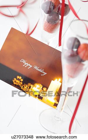 Stock Photo - Wedding card and fruit in glasses. Fotosearch