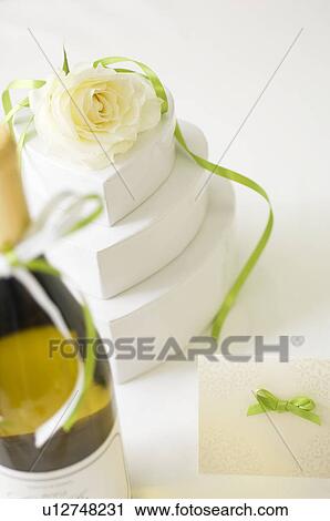 Stock Image - Wedding gift and wine bottle. Fotosearch