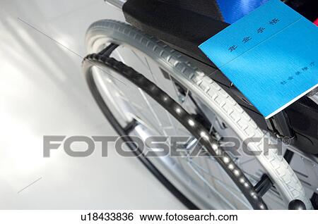 Wheelchair and pension booklets View Large Photo Image Stock Photograph - Wheelchair and pension booklets. Fotosearch