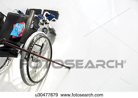 Wheelchair, cane and pension booklets View Large Photo Image Stock Photo - Wheelchair, cane and pension booklets. Fotosearch