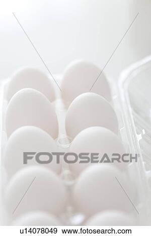 Stock Photo - White eggs in carton. Fotosearch